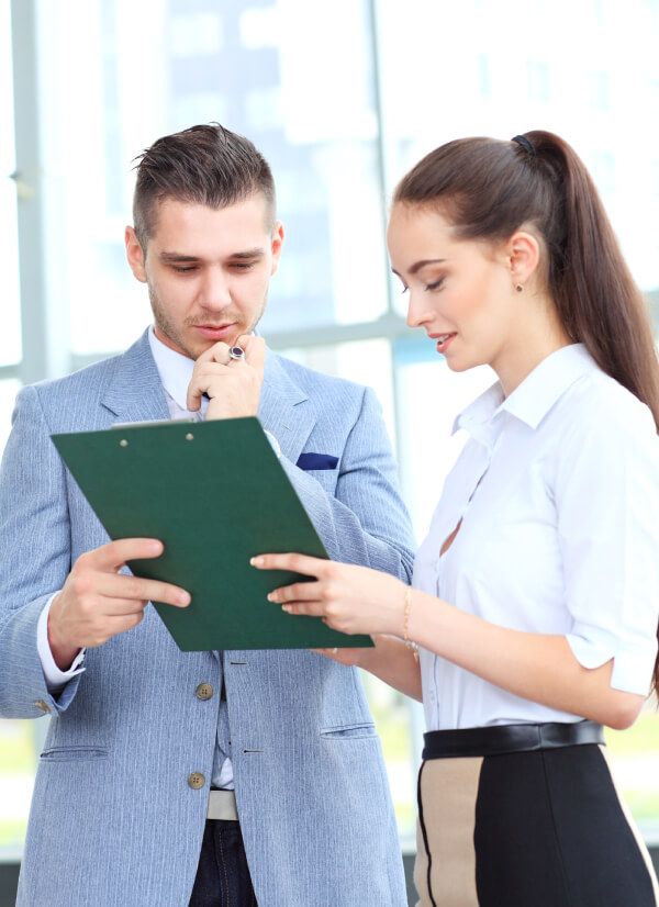 Business partners reviewing a listing together